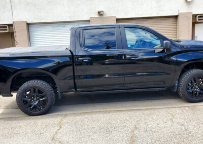 some time on a multi-step paint correction, so much so that we nick named it “The Devils Truck.” Once we got past the layers of swirls and scratches, we fine polished it to a slick surface, so that the dust would just blow off at freeway speeds. Finally, we coated it with our 5-year ceramic coating. We also added our promotional ceramic glass coating for free (normally a $150.00 Value).